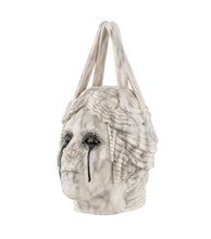 White faux marble handbag accented with strong dark veining